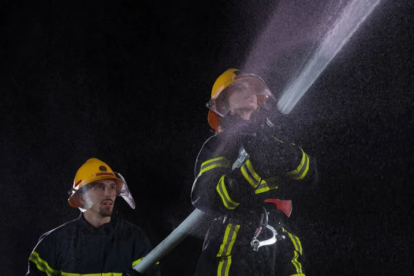 Firefighters Using Water Hose Eliminate Fire Hazard Team Female Male — Stock Photo, Image