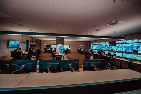 Group Security Data Center Operators Working Cctv Monitoring Room Looking — Fotografia de Stock