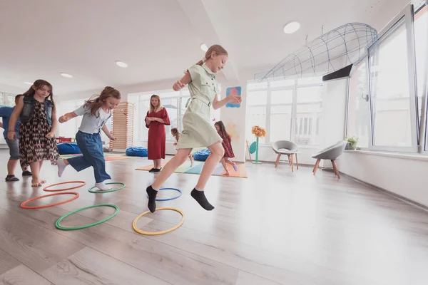 Small Nursery School Children Female Teacher Floor Indoors Classroom Doing — Stock Photo, Image