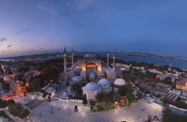 Istanbul, Turkey. Sultanahmet area with the Blue Mosque and the Hagia Sophia with a Golden Horn and Bosphorus bridge in the background at sunrise. Cinematic Aerial view. Hi quality 4K footage.