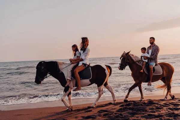 Family Spends Time Children While Riding Horses Together Sandy Beach —  Fotos de Stock