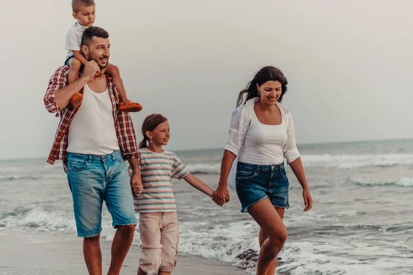 Family gatherings and socializing on the beach at sunset. The family walks along the sandy beach. Selective focus. High quality photo