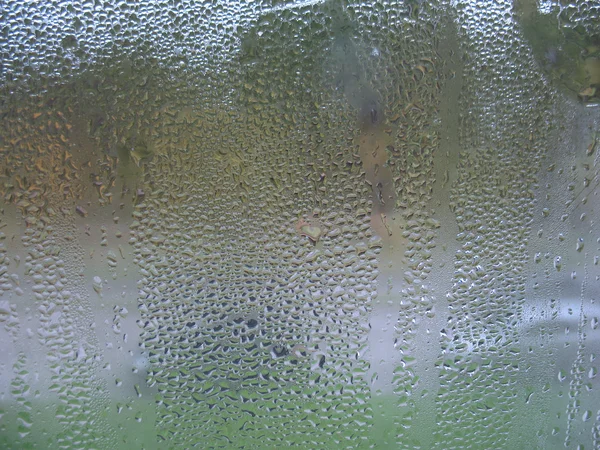 Janela de vidro e gotas de chuva — Fotografia de Stock