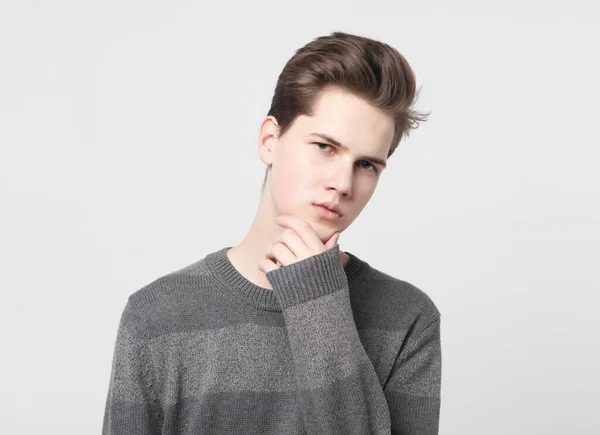 Young handsome teenage hipster guy posing against white background isolated, lifestyle people concept — Stock Photo, Image