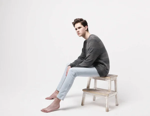 Stylish fashion man model sitting on the chair. — Stock Photo, Image
