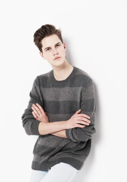 Young handsome teenage hipster guy posing against white background isolated, lifestyle people concept — Stock Photo, Image