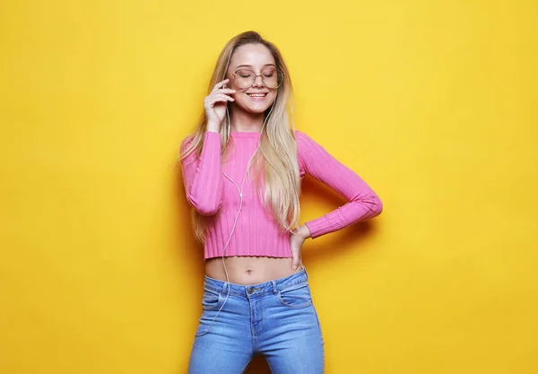 Nice Young Woman Headphones Laughing Looking Camera Yellow Background — Stock Photo, Image