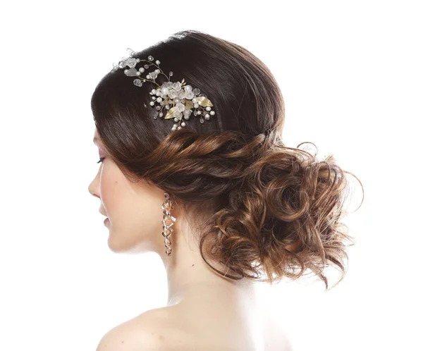 Wedding luxury hairstyle with a diadem. Young bride posing on a white background. — Stock Photo, Image
