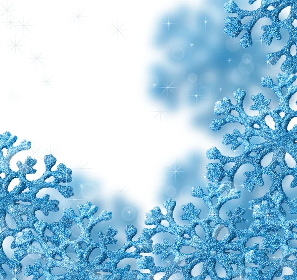 Siniset lumihiutaleet kauniilla taustalla . — kuvapankkivalokuva