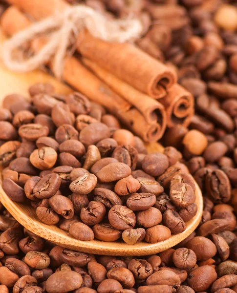 Scattering of coffee beans and cinnamon sticks . Stock Image