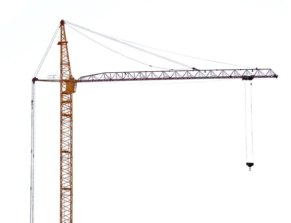 Yellow hoisting crane with dark boom — Stock Photo, Image