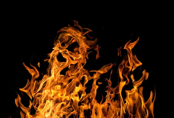 Isoliert auf schwarzem großen gelben Feuer — Stockfoto