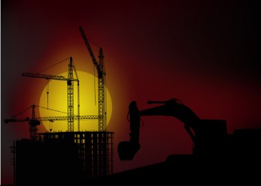 gün batımında ev bina yakınındaki Digger