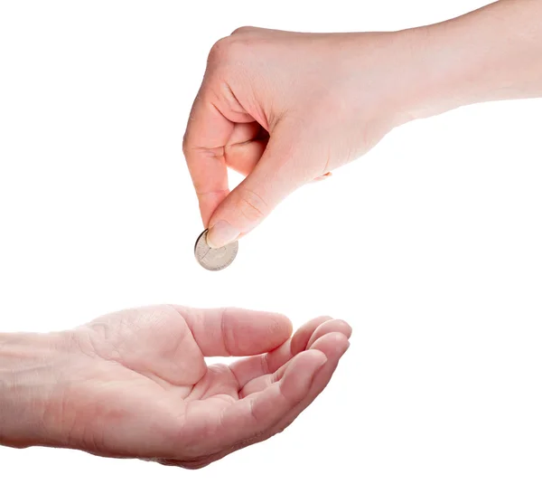 Woman hand giving coin to man hand — Stock Photo, Image