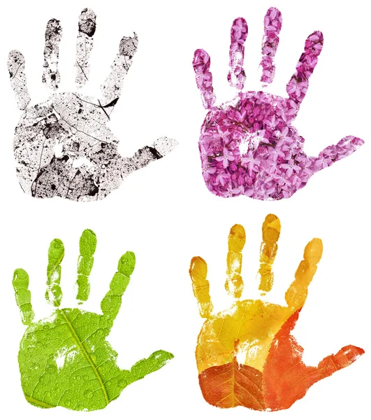 Set of conceptual hand imprints on four seasons backgrounds — Stock Photo, Image