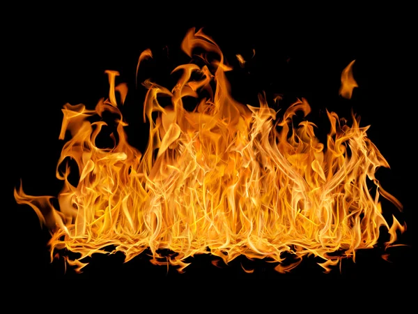 Yellow bright large fire isolated on black — Stock Photo, Image