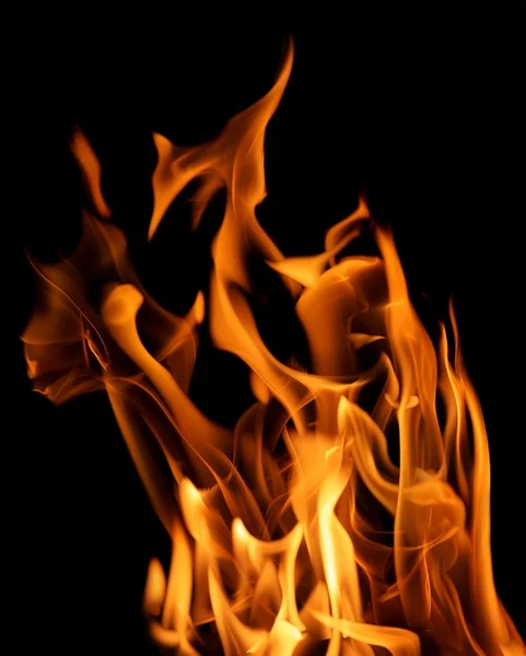 Yellow large fire sparks isolated on black — Stock Photo, Image