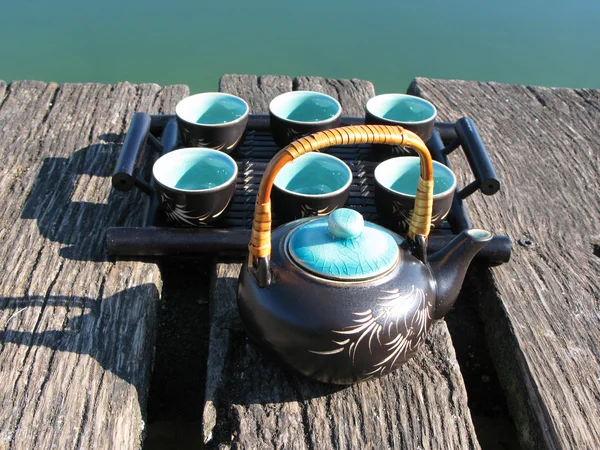 Chinese tea set on a wooden jetty — Stockfoto