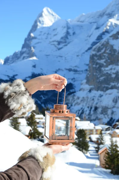 Lantern in the hand. Murren, Switzerland — Stock Photo, Image