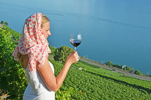 Woman tasting red wine in Lavaux, Switzerland — Stock Photo, Image