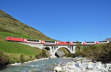 Train passing a bridge. Switzerland clipart