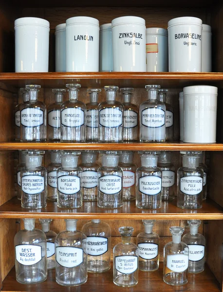 Bottles on the shelf of an old pharmacy — Stock Photo, Image