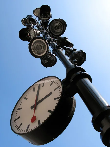 Lamppost with a clock on it against blue sky — Stock Photo, Image
