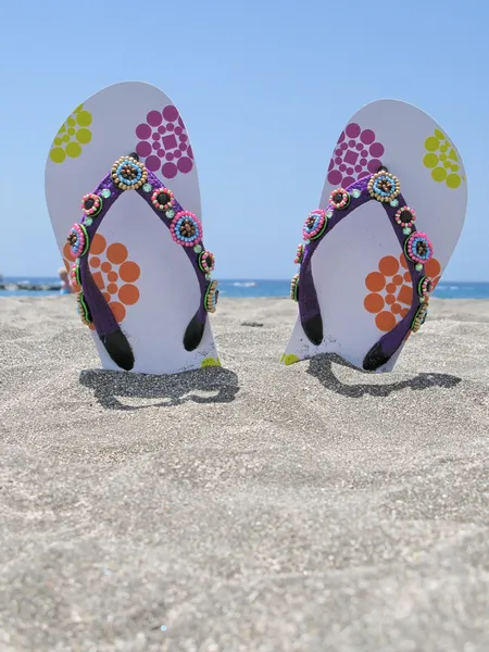 Flip-flops in the black sand of Tenerife island, Canaries — Stock Photo, Image