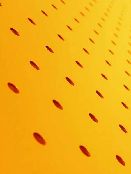 Orange perforated plate — Stock Photo, Image