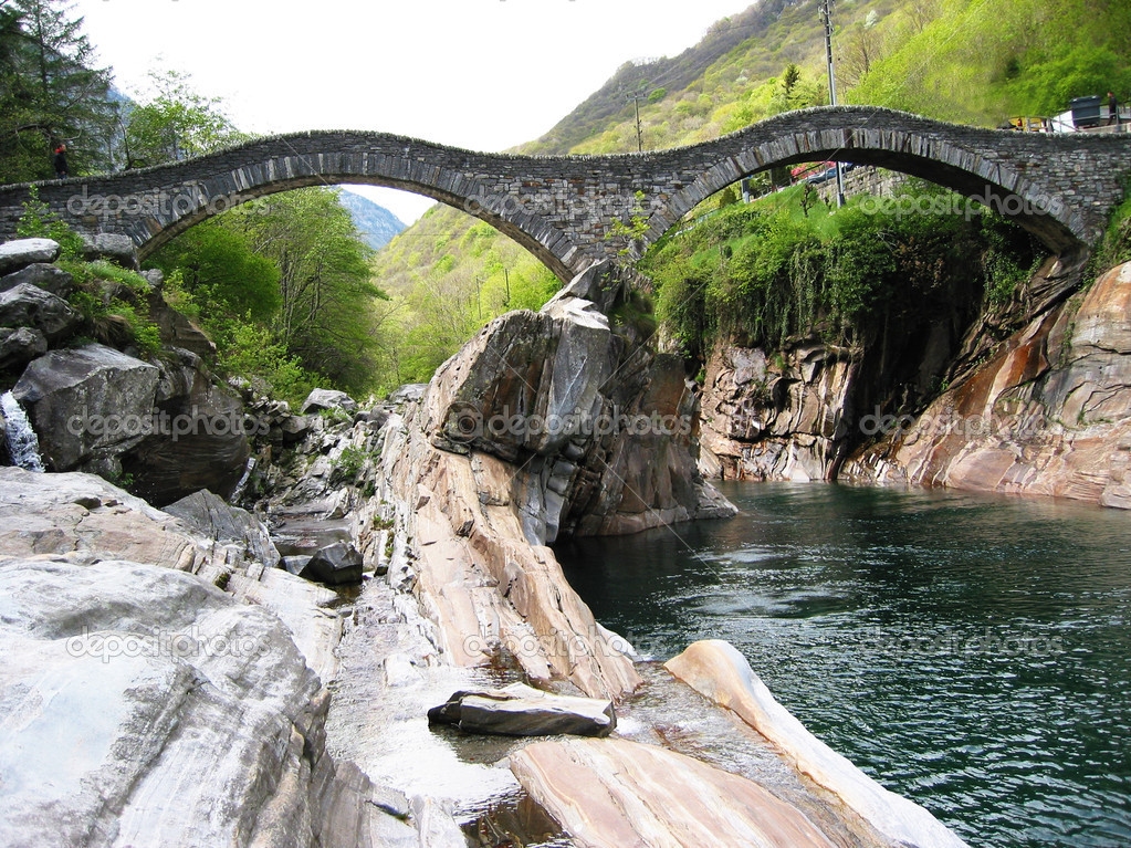 Ancient double arch bridge in Verzasca valley Switzerland