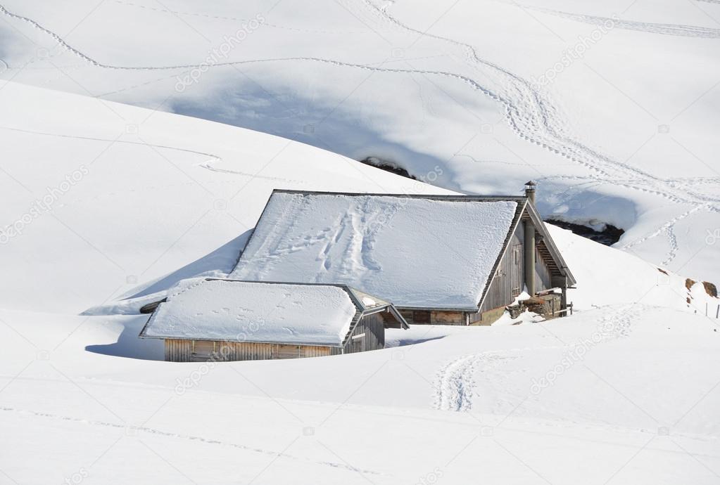 Farm house buried under snow, Melchsee-Frutt, Switzerland