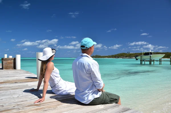 Couple on the wooden jetty — Stock Photo, Image