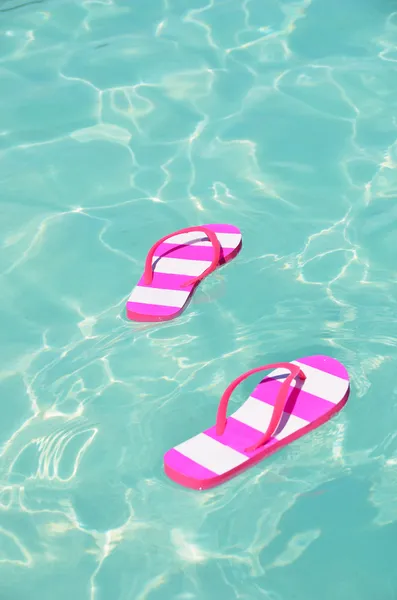 Flip-flops in water — Stock Photo, Image