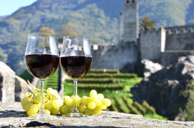 Pair of wineglasses and grapes. Bellinzona, Switzerland clipart