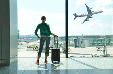 Girl at the airport window clipart