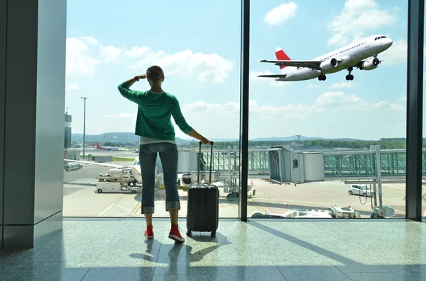 Girl at the airport window — Stock Photo, Image