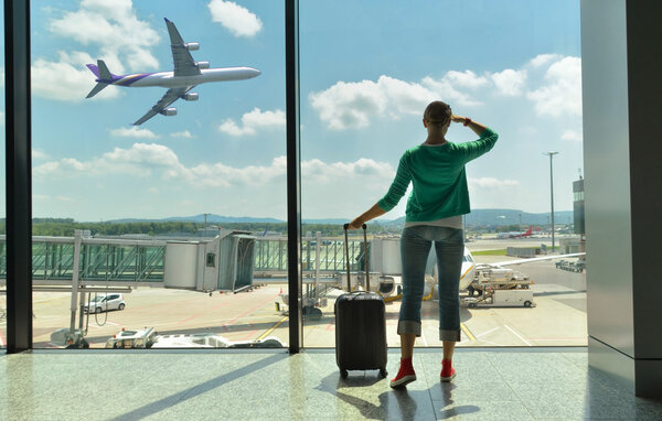 Girl at the airport window