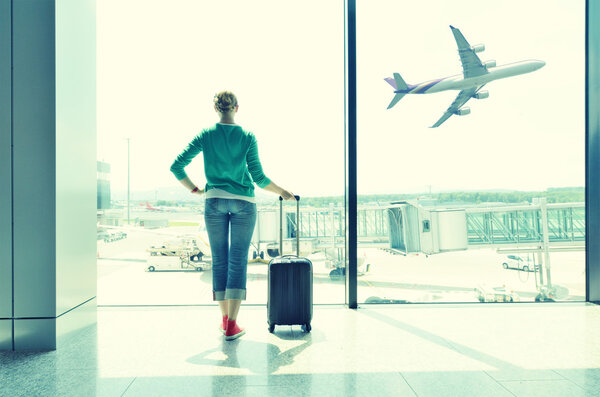 Girl at the airport window