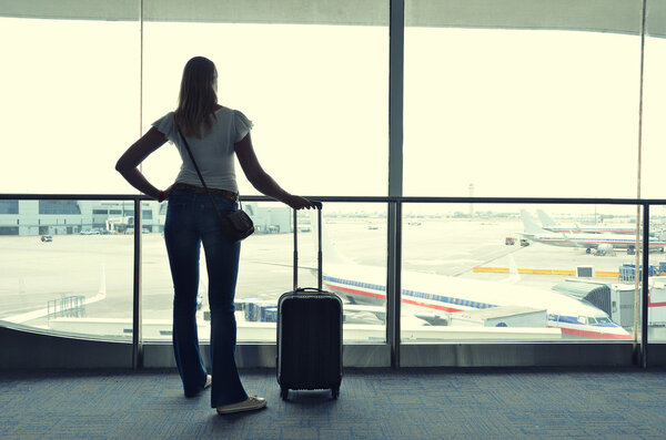 Girl at the airport window