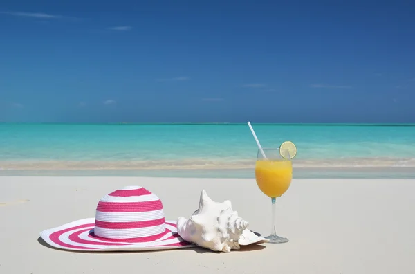 Hat and orange juice. Stock Photo