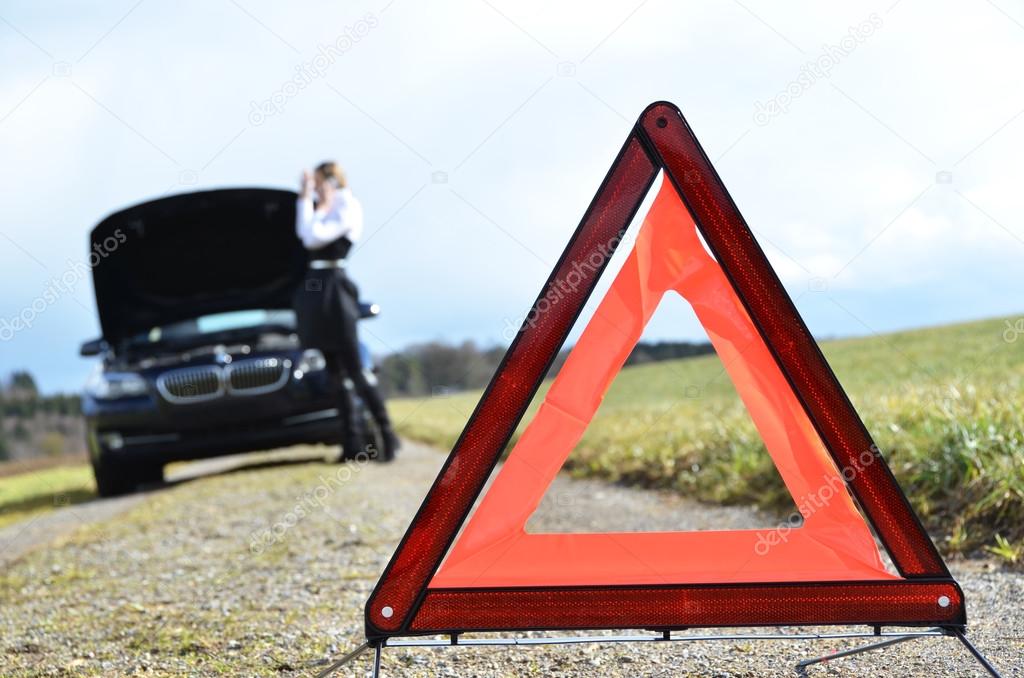 Girl and warning triangle