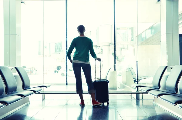 Girl in airport Stock Photo