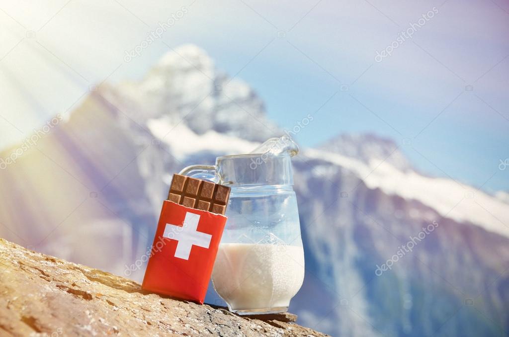 Swiss chocolate and jug of milk