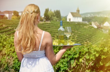 Girl holding wine and grapes clipart