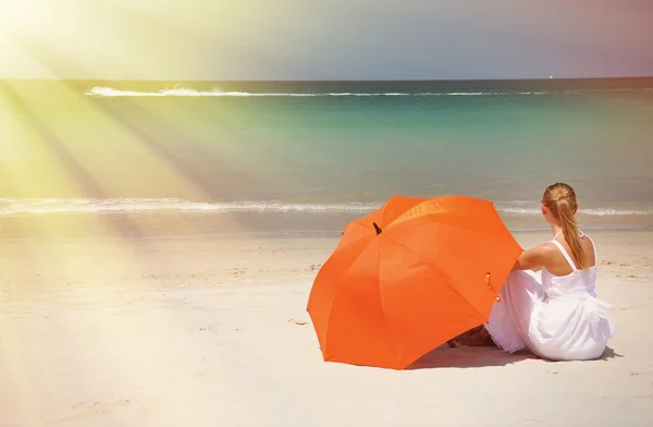 Girl with an orange umbrella — Stock Photo, Image