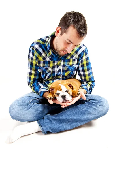 Cão na mão humana dormindo — Fotografia de Stock