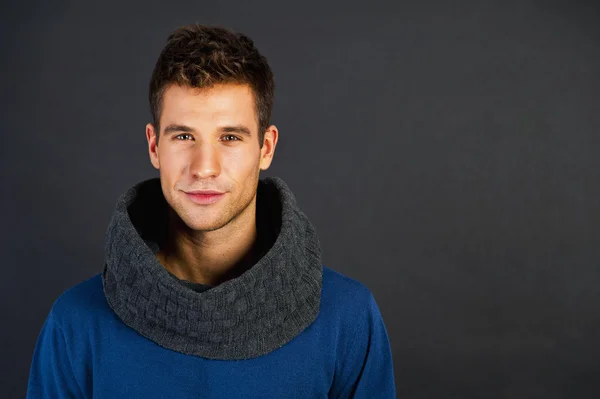 Handsome man with scarf on black background — Stock Photo, Image