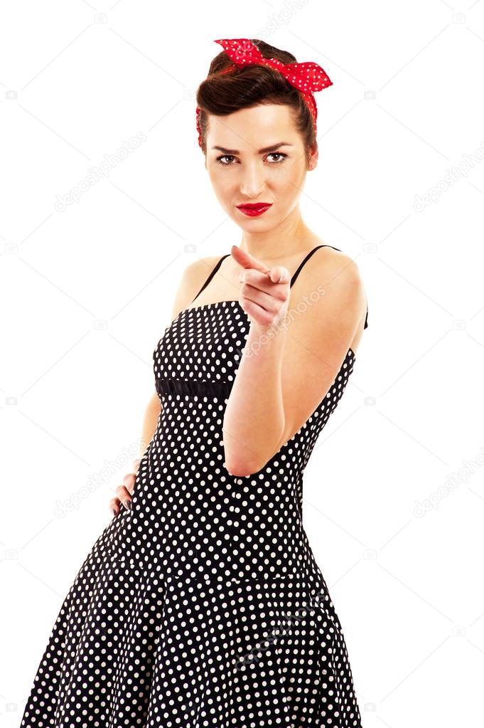 Woman in Pin-up style on white background pointing at you