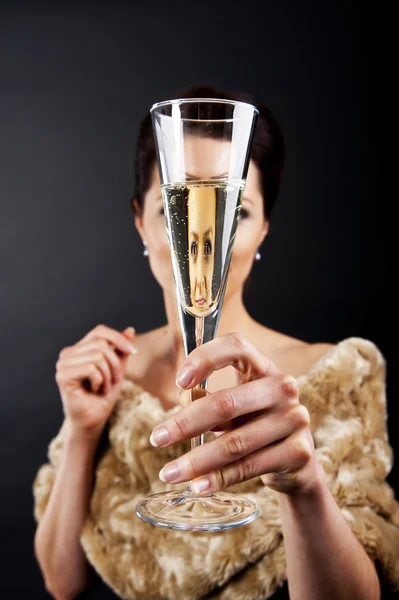 Glass of champanage holding by woman — Stock Photo, Image