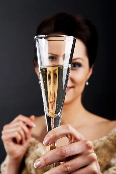 Glass of champanage holding by woman — Stock Photo, Image